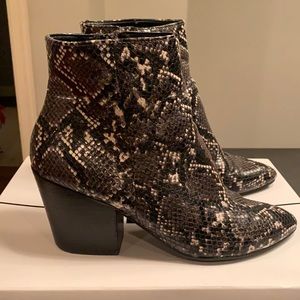 Dolce Vita leather booties in stylish black snake print.